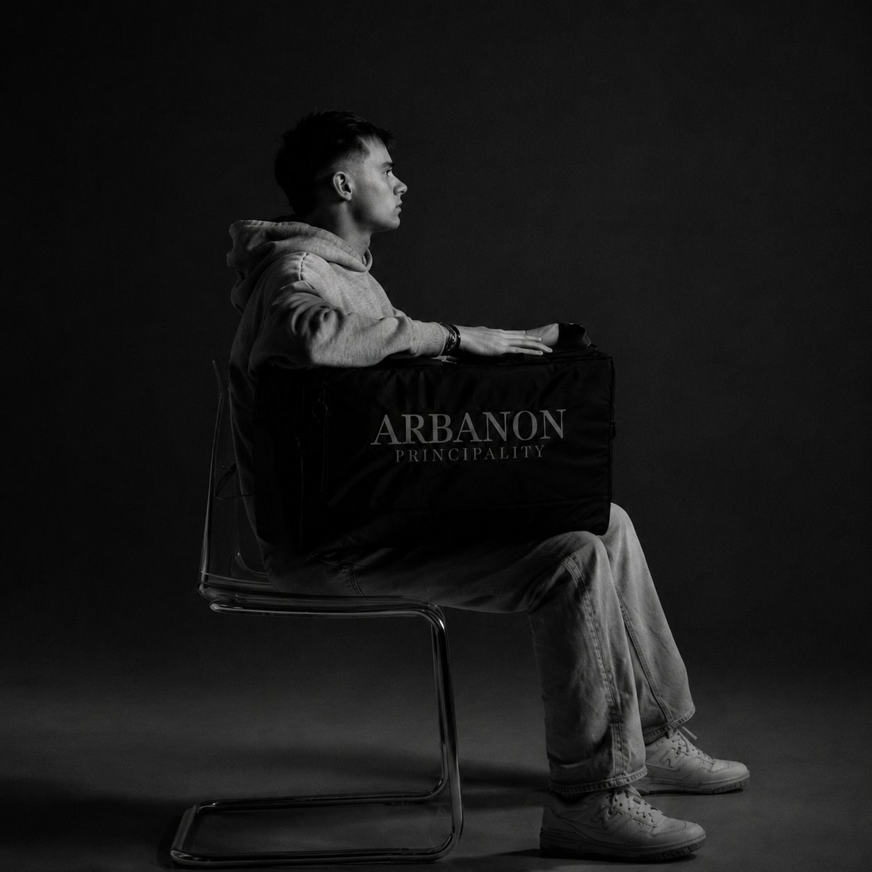 Model seated with the limited ARBANON Principality 001 bag