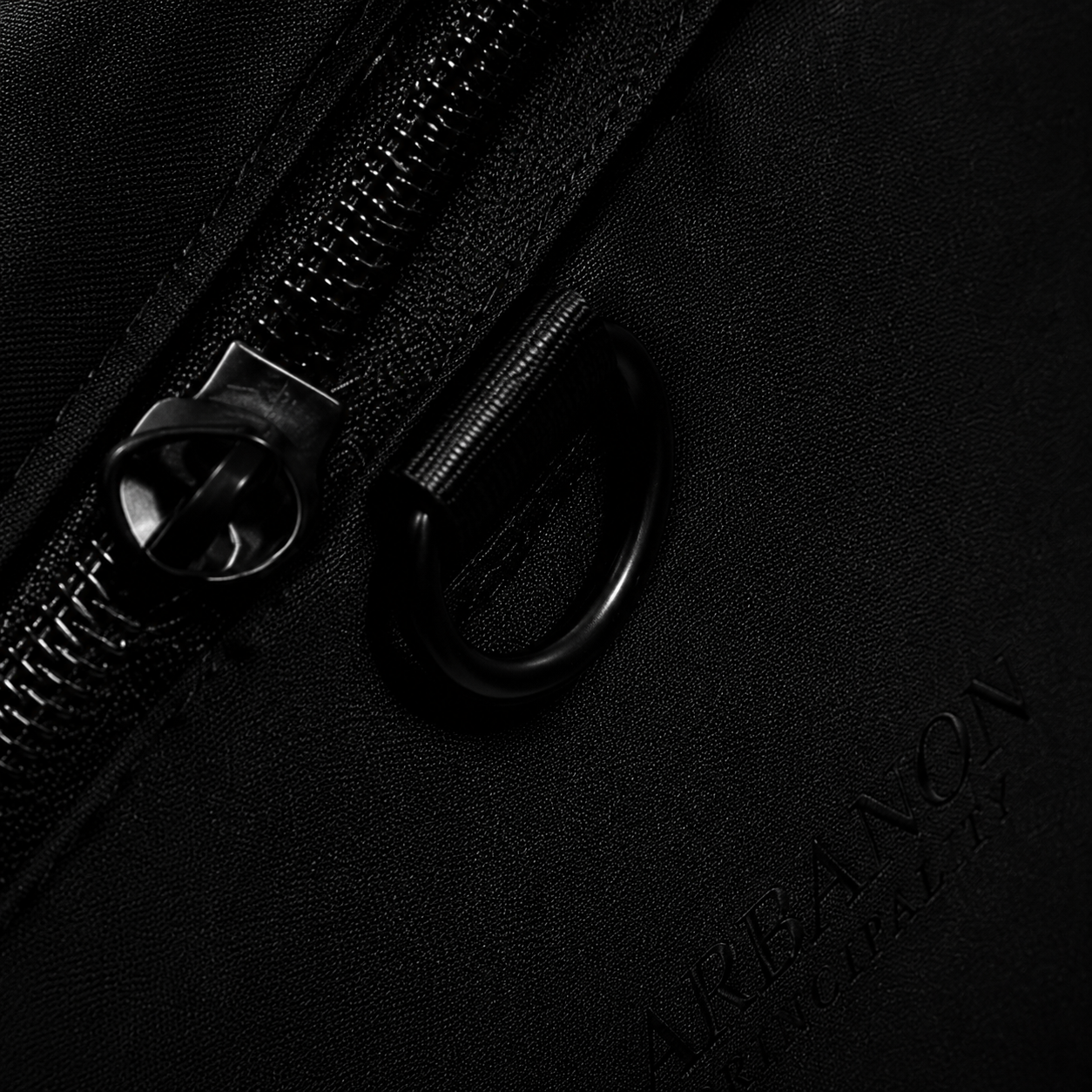 Close-up of the black zipper and hardware