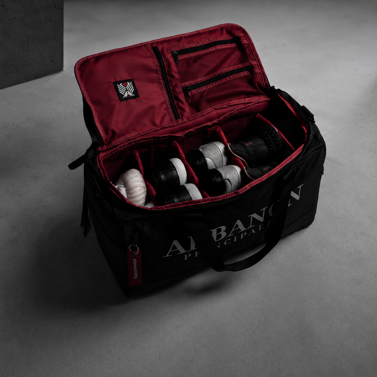 Red interior of the ARBANON bag with four pairs separated